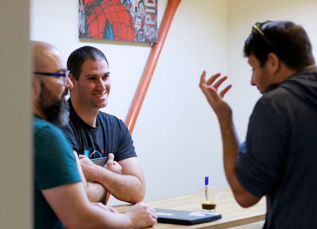 DoiT team members collaborating in the office